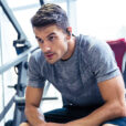 Portrait of a handsome fitness man resting at gym